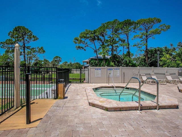 view of pool with a community hot tub