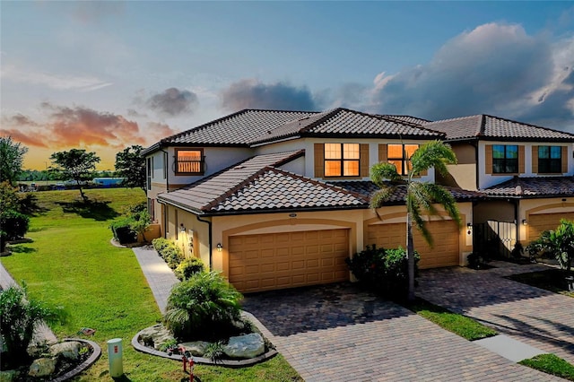 20100 Ragazza Cir Unit 101, Venice, FL 34293 - view of front of house featuring stucco siding, decorative driveway, and a tiled roof