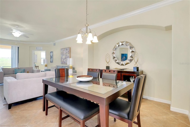 dining area with ceiling fan with notable chandelier, light tile patterned flooring, and ornamental molding