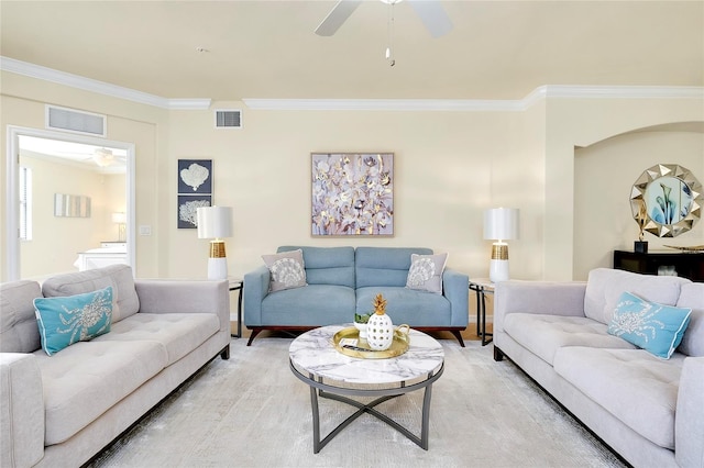 living room featuring wood-type flooring and crown molding