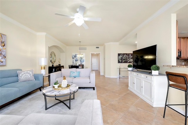 20100 Ragazza Cir Unit 101, Venice, FL 34293 - living room featuring ceiling fan, light tile patterned floors, ornamental molding, and arched walkways