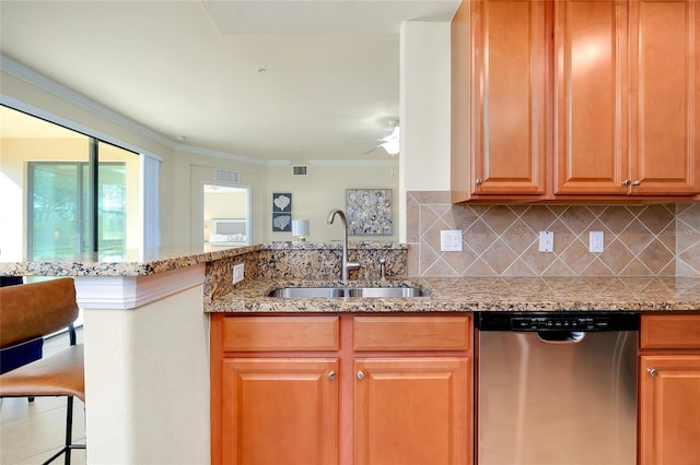 kitchen with decorative backsplash, light stone counters, ceiling fan, sink, and dishwasher