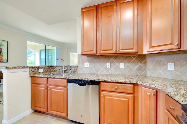 20100 Ragazza Cir Unit 101, Venice, FL 34293 - kitchen with dishwasher, light stone countertops, backsplash, a peninsula, and crown molding