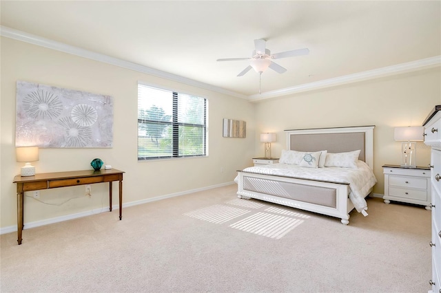 bedroom featuring ceiling fan, crown molding, and light colored carpet