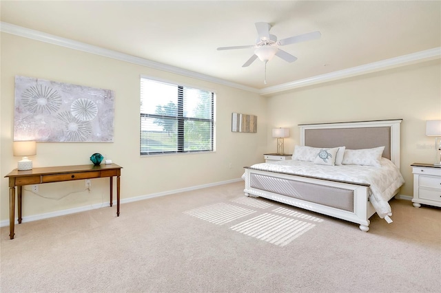 carpeted bedroom featuring ceiling fan and ornamental molding