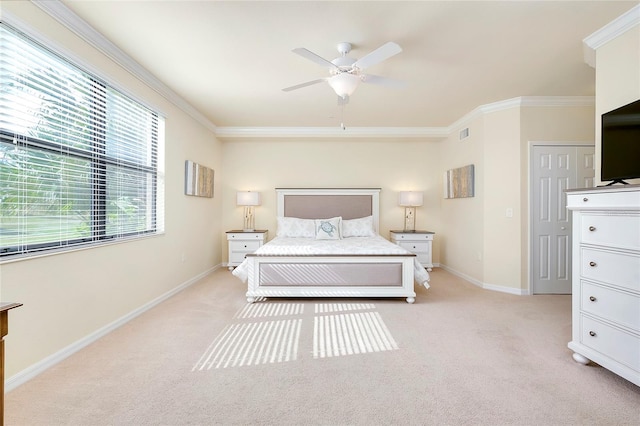 bedroom featuring light colored carpet, ceiling fan, and crown molding