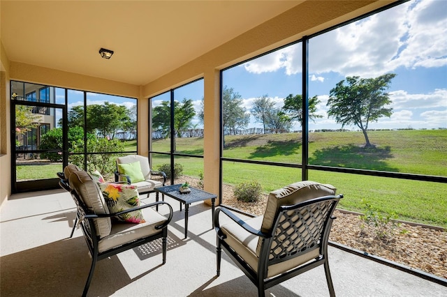 20100 Ragazza Cir Unit 101, Venice, FL 34293 - sunroom / solarium featuring an outdoor hangout area