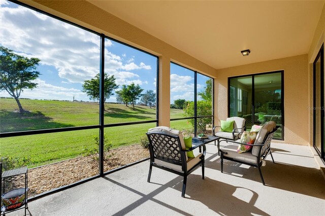20100 Ragazza Cir Unit 101, Venice, FL 34293 - sunroom with outdoor lounge area