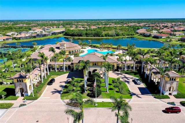 birds eye view of property with a water view