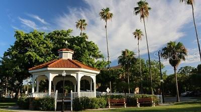 surrounding community with a gazebo and a lawn