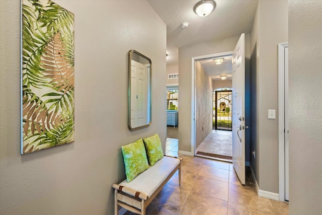 2049 Mesic Hammock Way, Venice, FL 34292 - corridor featuring light tile patterned floors and baseboards