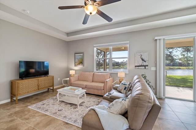 2049 Mesic Hammock Way, Venice, FL 34292 - living room with a water view, a ceiling fan, and light tile patterned floors