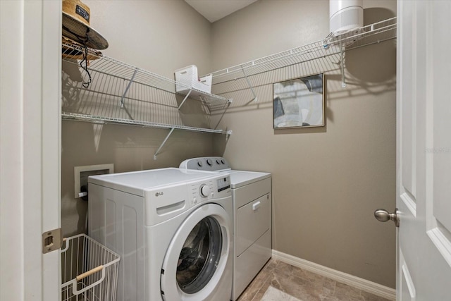 laundry room featuring washer and clothes dryer