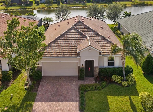 view of front of house featuring a water view and a garage