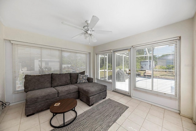 tiled living room featuring ceiling fan