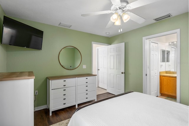 bedroom featuring hardwood / wood-style flooring, ensuite bath, and ceiling fan