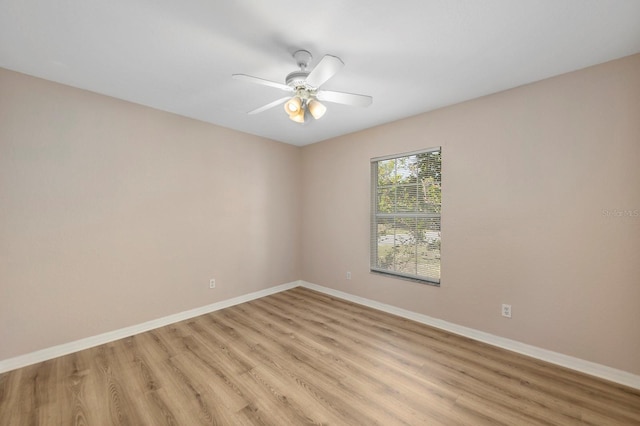 spare room with light hardwood / wood-style floors and ceiling fan