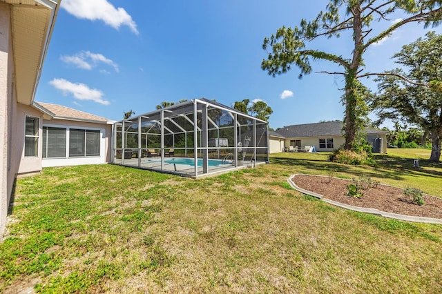 view of yard with glass enclosure