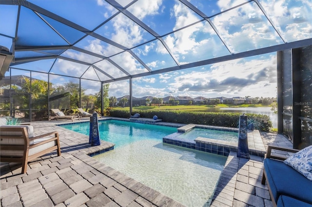 view of swimming pool featuring an in ground hot tub, a patio, and glass enclosure