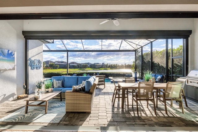 view of patio / terrace with an outdoor living space, ceiling fan, a pool, and glass enclosure