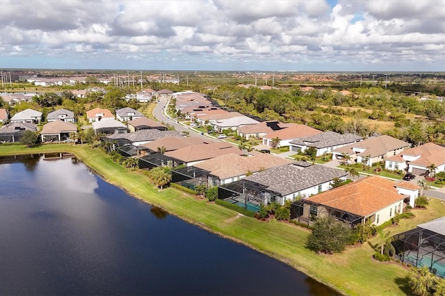 drone / aerial view with a water view