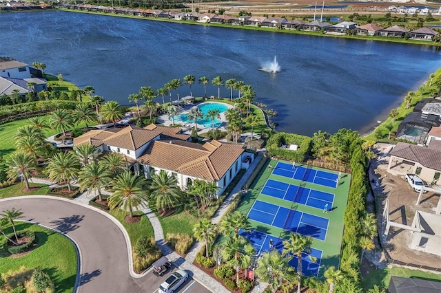 birds eye view of property with a water view