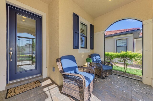 property entrance featuring a porch