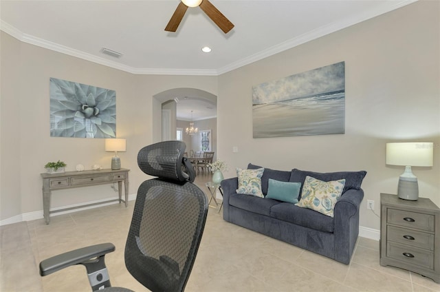 living room featuring ceiling fan with notable chandelier, ornamental molding, and light tile patterned floors