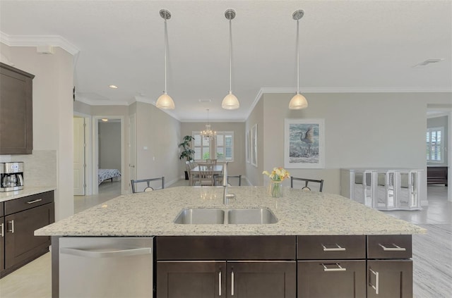 kitchen featuring a kitchen island with sink, plenty of natural light, stainless steel dishwasher, and ornamental molding