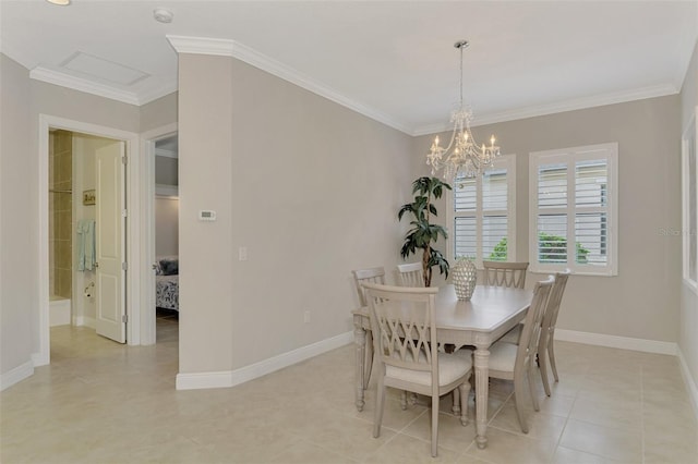 dining room featuring crown molding and a chandelier