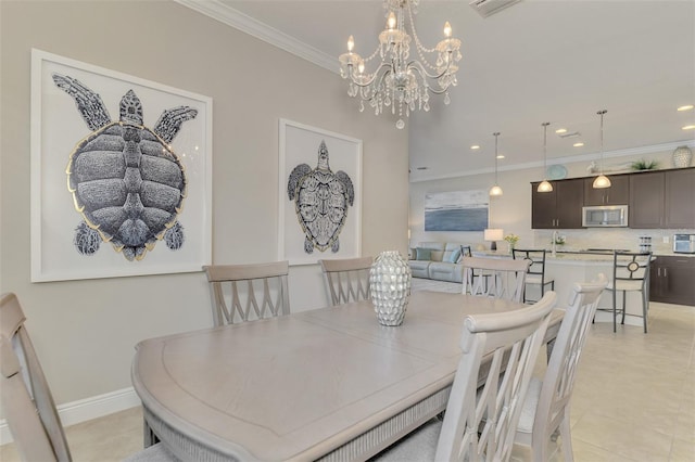 dining room with light tile patterned floors, crown molding, and an inviting chandelier