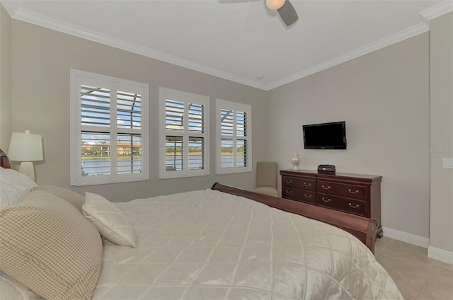 tiled bedroom featuring ceiling fan and crown molding