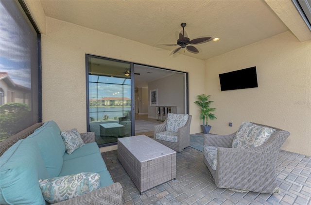 view of patio / terrace featuring an outdoor living space and ceiling fan