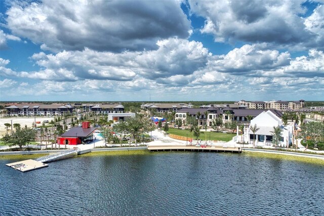 birds eye view of property featuring a water view