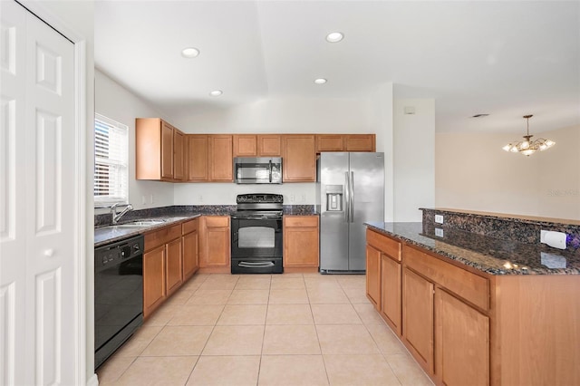 kitchen with lofted ceiling, black appliances, sink, hanging light fixtures, and a notable chandelier