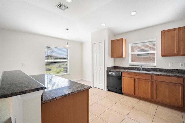 kitchen with dishwasher, sink, hanging light fixtures, dark stone counters, and light tile patterned floors