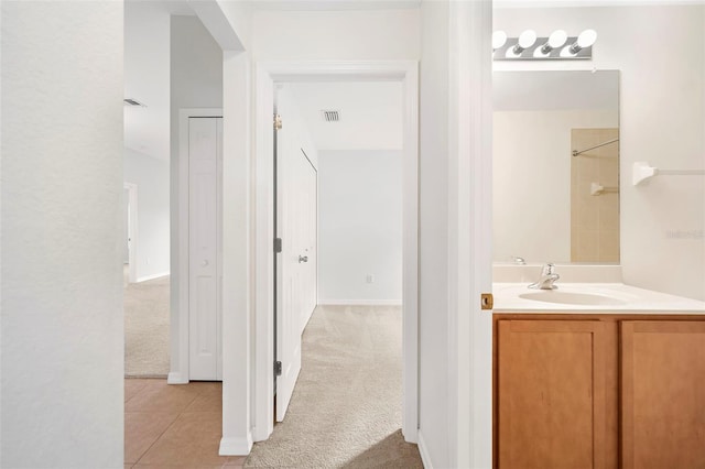 bathroom with vanity and tile patterned floors