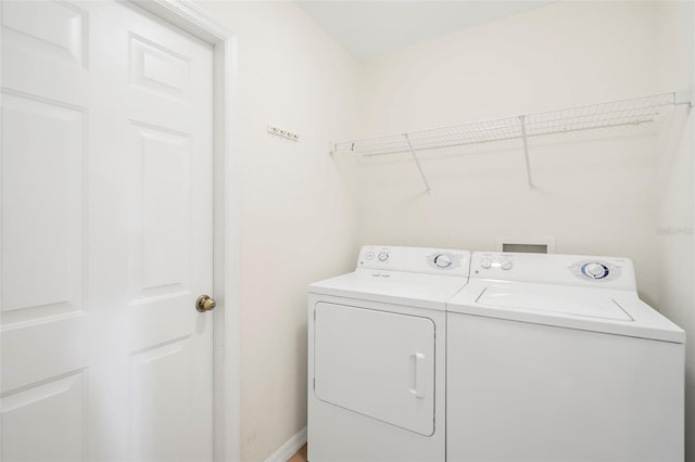 washroom with washer and dryer