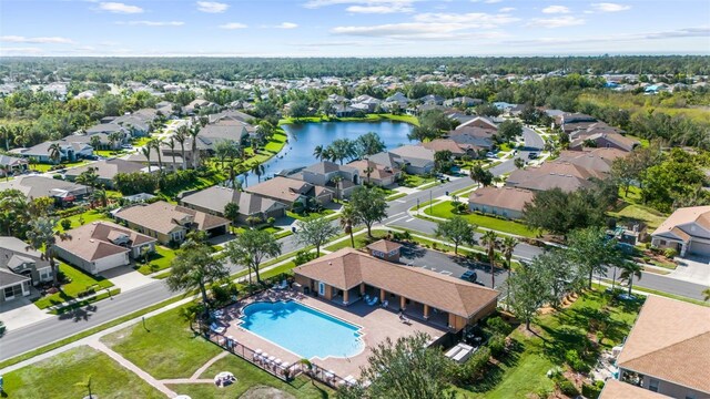 birds eye view of property with a water view