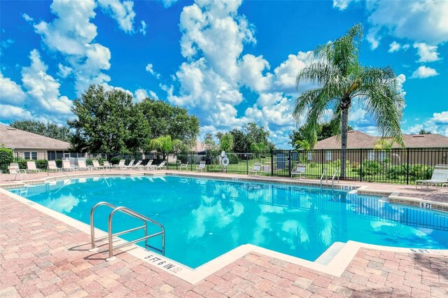 view of swimming pool with a patio area