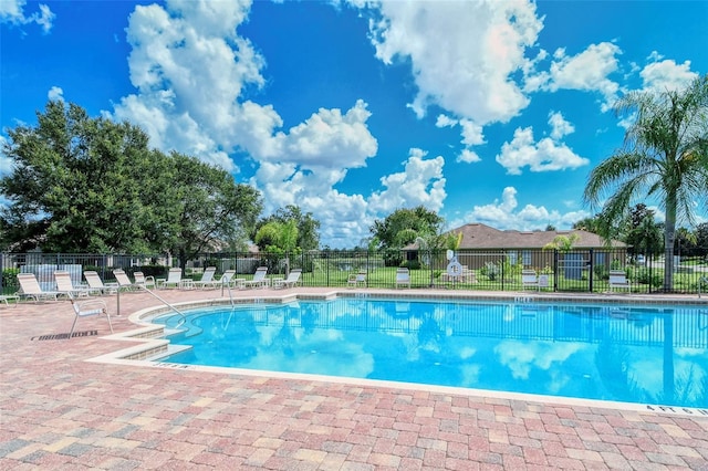 view of swimming pool featuring a patio