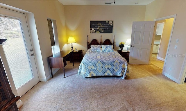 bedroom with light colored carpet