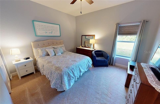 carpeted bedroom with ceiling fan