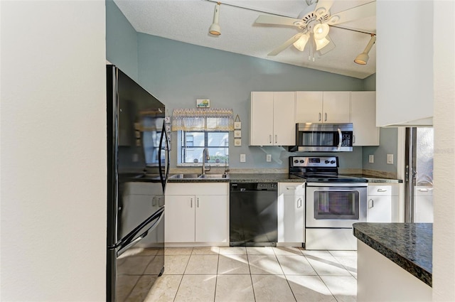 kitchen featuring sink, black appliances, white cabinetry, lofted ceiling, and light tile patterned flooring