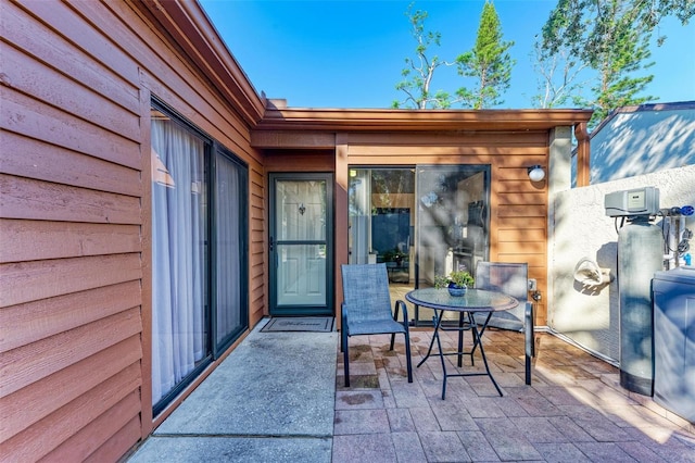 entrance to property with a patio area