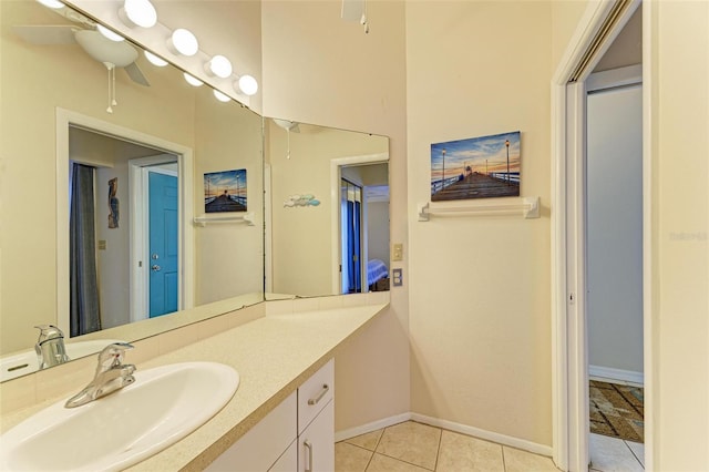 bathroom featuring tile patterned flooring, ceiling fan, and vanity