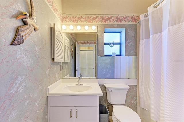 bathroom with vanity and toilet