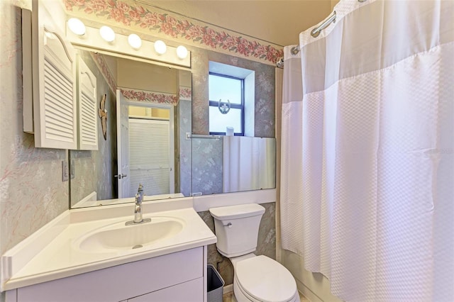 full bathroom with vanity, toilet, and shower / bath combo with shower curtain