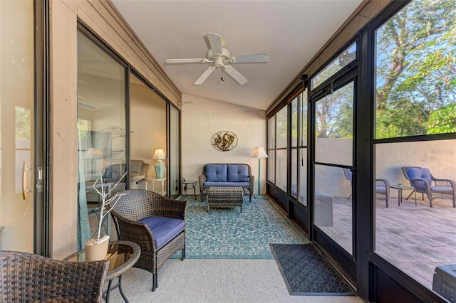 sunroom featuring ceiling fan and vaulted ceiling