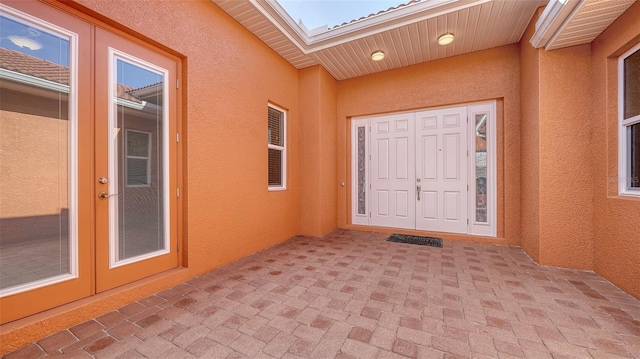 entrance to property featuring a patio